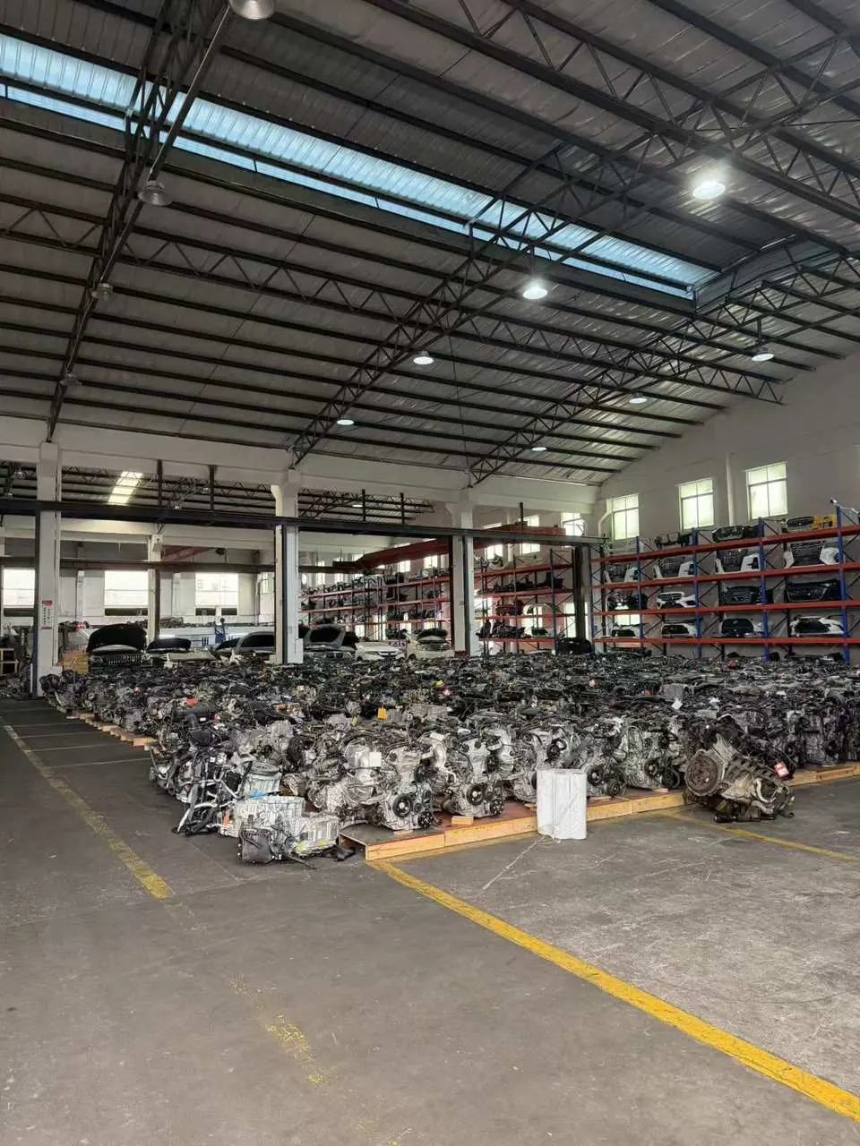Used engines sorted by make on warehouse racking